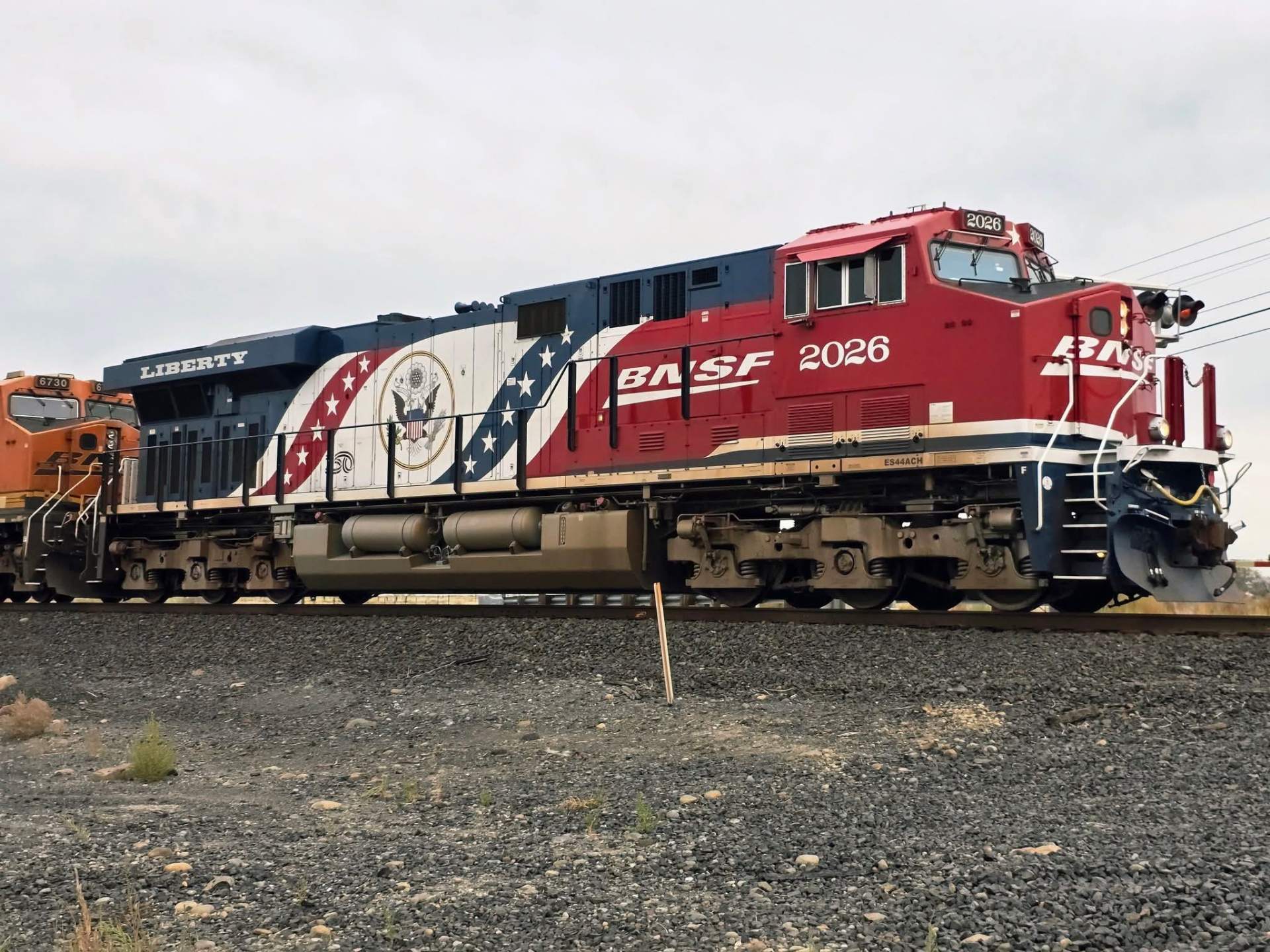 Red, white and blue BNSF 2026 Liberty locomotive with the presidential seal